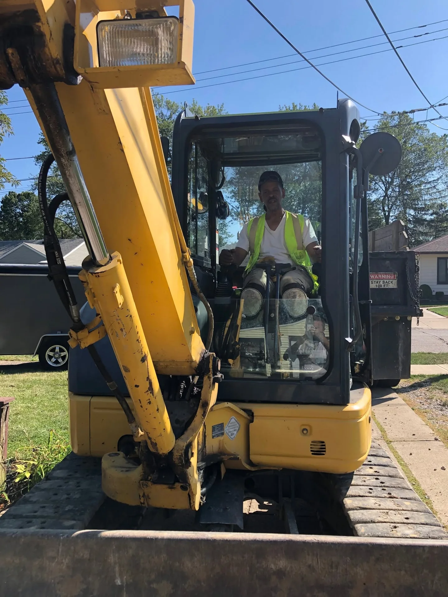 FatirGroup equipment operator seated in an excavator