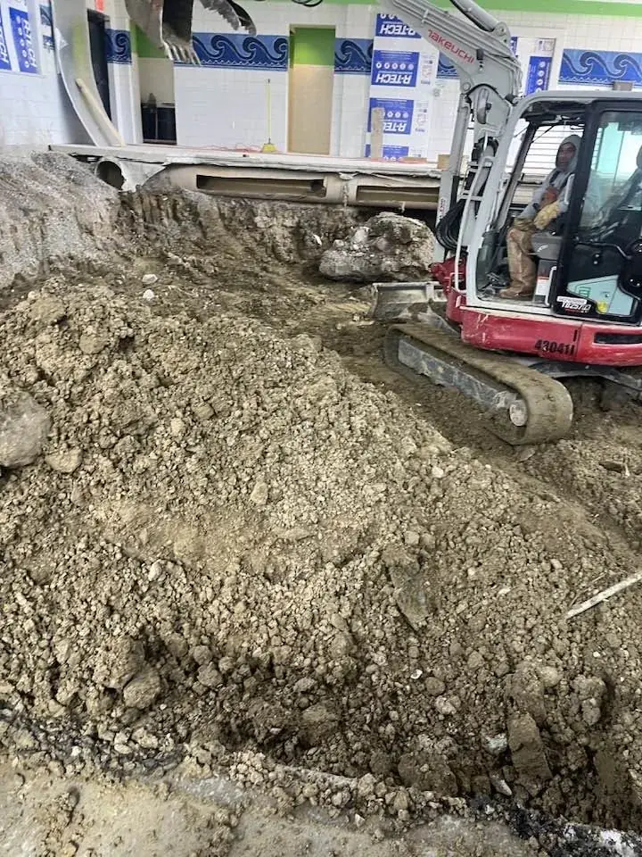 Interior excavation with compact equipment and removed material