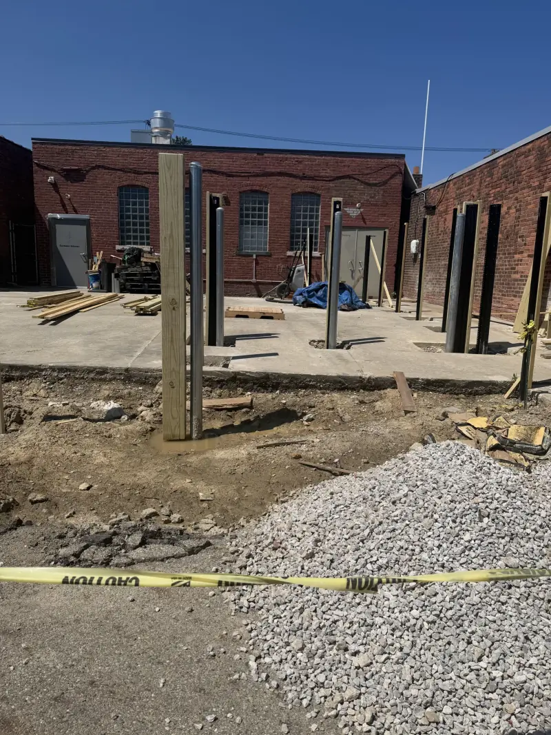 Additional view of fence installation work